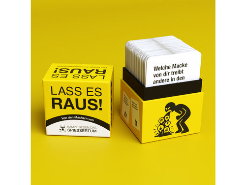 Lass es raus!: geöffnete Box mit Fragekarten-Stapel auf gelbem Hintergrund.