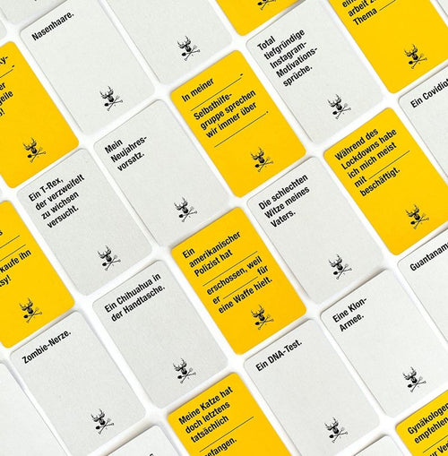 Kampf gegen das Spießertum Travel Edition: Beispielkarten in Gelb und Weiß im Überblick.